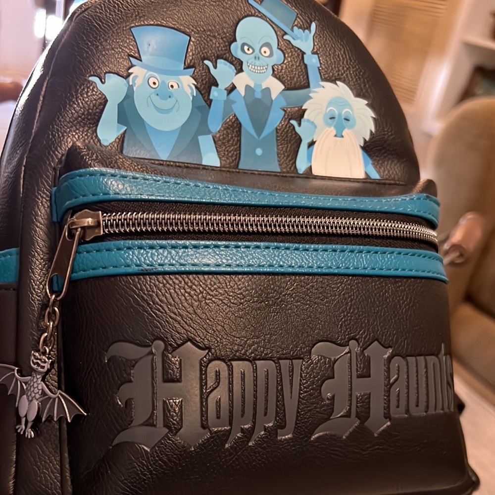 Haunted Mansion Loungefly Backpack, used.  Happy Haunts. W/ hitch hiking ghost.